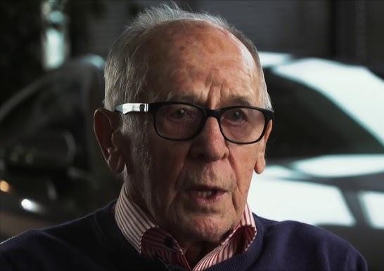 Rajdowy samochód Sobiesława Zasady (Porsche 911/BMW 2002/Fiat 124 Abarth) w akcji na trasie rajdu, z kurzem lub błotem w tle.